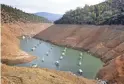  ?? RICH PEDRONCELL­I/AP ?? Houseboats float in the drought-lowered waters of Oroville Lake near Oroville, Calif., in 2014.