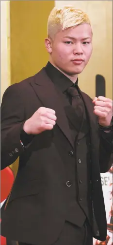  ?? Toshifumi Kitamura / AFP / Getty Images ?? Kickboxer Tenshin Nasukawa of Japan poses for photograph­s during a press conference at a hotel in Tokyo on Saturday. Nasukawa will fight boxing superstar Floyd Mayweather Jr. of the U.S. in their bout on Monday.