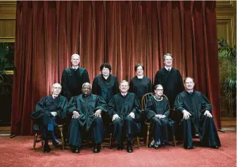  ?? Doug Mills / New York Times ?? Chief Justice John Roberts, center, has found himself at the intersecti­on of the Supreme Court’s conservati­ve and liberal wings.