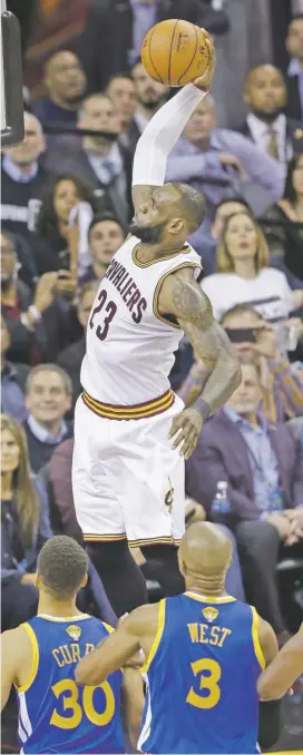  ?? ASSOCIATED PRESS PHOTOS ?? ABOVE: The Warriors’ Shaun Livingston lands on the Cavaliers’ Deron Williams in a game that featured a lot of fouls.