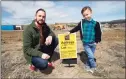  ?? Associated Press ?? Chad Zolman, left, with his 5-year-old son, Quinten, on Wednesday at the site of their yet-to-be-constructe­d home in Castle Rock, Colo. “The rates kept going up, and the more the rates kept going up, the less house you can buy,” said Zolman, 41. “And the less house you can buy in this market, that’s not good. You have to be able to pony up the cash.”