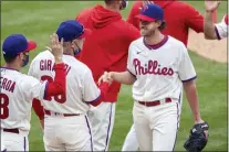  ?? LAURENCE KESTERSON — FOR THE ASSOCIATED PRESS ?? Phillies starter Aaron Nola, right, smiles as he shakes hands with manager Joe Girardi after pitching a complete game Sunday’s in a 2-0victory over the Cardinals.