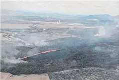  ??  ?? BLAZING AWAY: The Mt Emerald bushfire, near Tolga, on Sunday, one of two big blazes in the Atherton Tableland.