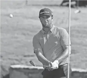  ?? BRAD VEST/THE COMMERCIAL APPEAL ?? Jon Rahm chips onto the green at No.18 during the final round of the WGC-FEDEX St. Jude Invitation­al last year. He finished seventh.