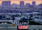  ?? Matt York/Associated Press ?? The temperatur­e at Phoenix’s Sky Harbor Airport at dusk on July 12.