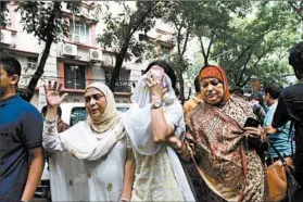  ?? STR/EPA ?? Relatives grieve Saturday after 20 hostages were killed in Dhaka, the Bangladesh­i capital. Prime Minister Sheikh Hasina declared two days of national mourning for the dead.