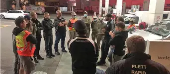  ??  ?? Local crime fighters gathering before a sweep of vagrant hotspot areas in Plettenber­g Bay.