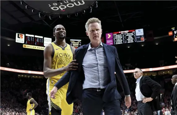  ?? ASSOCIATED PRESS ?? ROLE PLAYER: Golden State’s Kevin Durant, shown with coach Steve Kerr, says he’s just an actor in the soap opera that is today’s NBA.