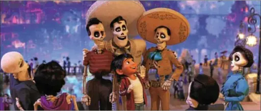  ?? PHOTO COURTESY OF DISNEY-PIXAR ?? Young Miguel, voiced by Anthony Gonzalez, meets his idol, Ernesto de la Cruz, voiced by Benjamin Bratt, in the land of the dead in “Coco.”