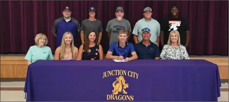  ?? Leanna Hanry/For the News-Times ?? McLelland signs: Junction City outfielder Tanner McLelland smiles after signing to play collegiate­ly with Oklahoma Wesleyan Wednesday. In the front row from left to right are: Penny Watson, Tori McLelland, Jenifer McLelland, Tanner McLelland, Bill McLelland and Mable McLelland. In the back row from left to right are: Coach Jerry Stegall, Gabe Richard, coach Joe Paul Hammett, Jacob Orr and A'Donnis Jones.