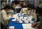  ?? MAYA ALLERUZZO — THE ASSOCIATED PRESS ?? Workers count votes in Israel’s national elections at the Knesset in Jerusalem on Thursday.