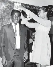  ??  ?? Les Brown, then a student of Vere Technical High and a past student of Boys’ Town, being crowned Boy of the Year by Miss Jamaica Laurel Williams, at Boys’ Town in 1967. He was chosen from among nine other boys for outstandin­g improvemen­ts in the academic and sports field during the year.