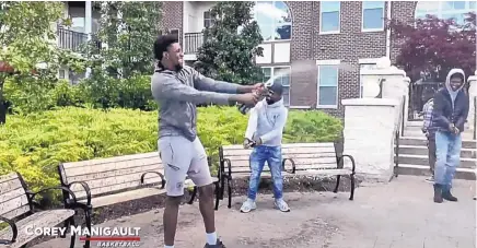  ?? UNM ATHLETICS VIA YOUTUBE ?? Former Lobo men’s basketball player Corey Manigault celebrates with some champagne with some friends home in Maryland as part of a video played of UNM student-athlete graduates Saturday during a virtual commenceme­nt ceremony.