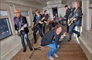  ??  ?? Foreigner — (clockwise from front) singer Kelly Hansen, guitarists Mick Jones and Jeff Pilson, saxophonis­t Tom Gimbel, drummer Chris Frazier, keyboard player Michael Bluestein and guitarist Bruce Watson — perform Friday at the Walmart Arkansas Music...