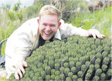  ?? ?? Roy Caister embracing a monstrous Euphorbia pulvinata (Pincushion Barrelwort) at Bivane dam. Photo: Sharon Louw