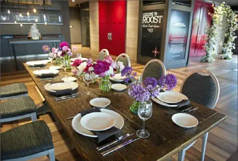  ?? Pam Panchak/Post-Gazette ?? Tables spaced far apart are one part of the minimalist weddings offered by The Roost in Downtown.