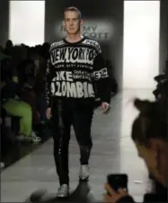  ?? AP PHOTO/JULIO CORTEZ ?? Fashion designer Jeremy Scott appears on the runway after showing his latest collection during New York Fashion Week on Friday in New York.