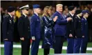  ?? Photograph: Alika Jenner/ Getty Images ?? US president Donald Trump and first lady Melania Trump took the field at the start of the College Football Playoff national championsh­ip game between LSU and on Monday night.