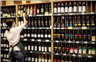  ?? PHOTO: AFP ?? An employee stacks shelves of Australian wine at a store in Beijing on Aug. 18, 2020.