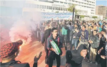  ??  ?? STREET DEMONSTRAT­ION: Egyptians protesters shout slogans during a demonstrat­ion outside the government office in the canal city of Port Said, southern Egypt. — AFP photo