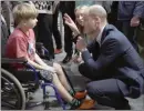  ?? The Associated Press ?? Britain’s Prince William talks to a young boy as he visits an accommodat­ion centre, for Ukrainians who fled the war, in Warsaw, Poland, Wednesday.