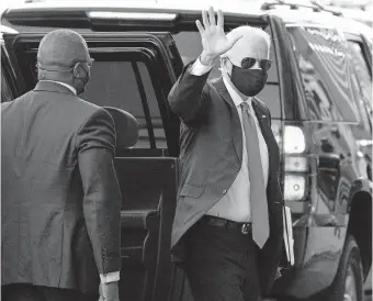  ??  ?? President-elect Joe Biden waves as he arrives at The Queen theater for a meeting with Vice President-elect Kamala Harris, Senate Minority Leader Chuck Schumer of N.Y., and House Speaker Nancy Pelosi of Calif., Friday in Wilmington, Del. [ALEX BRANDON/ THE ASSOCIATED PRESS]