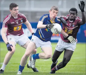  ??  ?? Westmeath's Stephen Ward and Boidu Sayeh combine to try stop Wicklow's Patrick O'Connor during the Leinster Minor football championsh­ip.