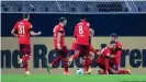  ??  ?? Ellyes Skhiri, second from right, leads the celebratio­ns after his second goal against Dortmund