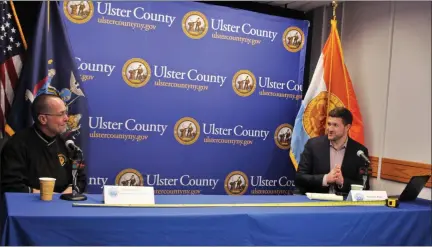  ?? PHOTO PROVIDED ?? Ulster County Executive Pat Ryan, left, and county Director of Emergency Services Steve Peterson use a tape measure to demonstrat­e the 6 feet of separation recommende­d for social distancing during a Facebook town hall on Friday in Kingston, N.Y.