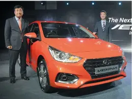  ?? — Biplab Banerjee ?? Hyundai Motors MD Y.K. Koo (left) and designer head H.S. Haduring the launch of the Next Gen Verna sedan car in new Delhi on Tuesday.