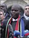  ?? (AP/Patrick Post) ?? South Africa’s Minister of Justice and Correction­al Services Ronald Lamola (center) addresses the media Thursday outside the Internatio­nal Court of Justice in The Hague, Netherland­s.