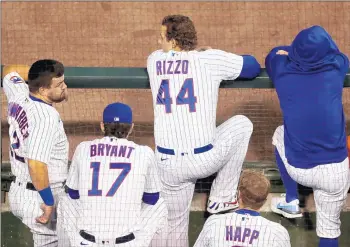  ?? /CHRIS SWEDA / CHICAGO TRIBUNE ?? Kyle Schwarber, Kris Bryant, Anthony Rizzo and Ian Happ hang out in the dugout atWrigley Field on Sept. 19.