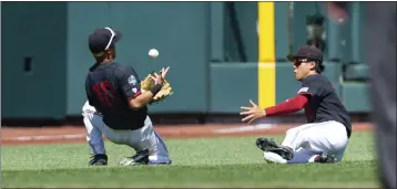  ?? JOHN PETERSON – THE ASSOCIATED PRESS ?? Stanford shortstop Adam Crampton, left, tries to make a play as left fielder Eddie Park looks on in the eighth inning.