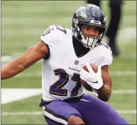  ?? Aaron Doster / Associated Press ?? Baltimore Ravens running back J.K. Dobbins runs against the Cincinnati Bengals on Sunday in Cincinnati.