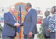  ??  ?? PAYING VISIT: US Secretary of State Rex Tillerson shakes hands with Kenyan President Uhuru Kenyatta after their meeting at the State House in Nairobi, Kenya, on Friday.