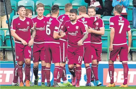  ?? Picture: SNS. ?? Lichties striker Steven Doris, second from right, celebrates his equaliser with team-mates.