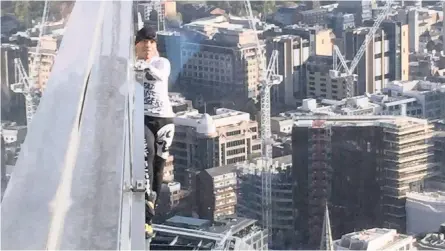  ?? | Reuters ?? FRENCH free-climber Alain Robert, known as ‘Spiderman’, attempts to climb up the outside of the Heron Tower without ropes in the financial district of London, yesterday. Robert, 56, took an hour to clamber up the 230m-high building. Police arrested him at the top for causing a public nuisance. Robert has climbed more than 150 skyscraper­s around the world, including Dubai’s Burj Khalifa, the world’s tallest building, the Eiffel Tower, and the Sydney Opera House.