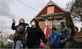  ?? Photograph: Nathan Howard/Getty Images ?? The Kinney family and activists outside the Red House in Portland. Michael Kinney said: ‘It’s a fight against systemic racism and gentrifica­tion that’s been going on for years.’