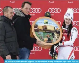  ?? — AFP ?? VAL-DíISERE: Austria’s Anna Veith (R) poses with a cheese after winning the women’s Super-G race at the FIS Alpine Skiing World Cup in Val-d’Isere, French Alps, yesterday.