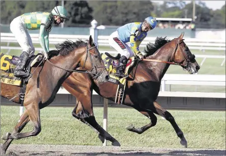  ?? MEL EVANS/ASSOCIATED PRESS ?? Jockey Victor Espinoza (right) and American Pharoah cruised by runner-up Keen Ice on Sunday to win their first race since claiming the Triple Crown.