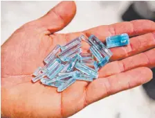  ?? Parker Seibold, The Gazette ?? Jason Roys, 40, holds a handful of aquamarine crystals that he and Ian Schimpfle, 39, found on their first Mount Antero dig of the season a few weeks ago.