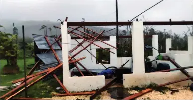  ?? The Associated Press ?? In this photo provided by Glen Hunter, damage from Super Typhoon Yutu is shown outside Hunter’s home in Saipan, Commonweal­th of the Northern Mariana Islands.