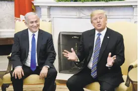  ?? Olivier Douliery / Tribune Co. ?? Israeli Prime Minister Benjamin Netanyahu (left) discusses Mideast security issues with President Trump in the Oval Office of the White House.