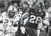  ?? Charlie Neibergall / Associated Press ?? Iowa State’s Breece Hall rushed for 242 yards and scored four TDs in the Cyclones’ rout of TCU.