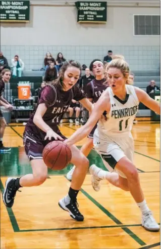  ?? JAMES BEAVER/FOR DIGITAL FIRST MEDIA ?? Pennridge junior Julia Kreider (11) attempts the steal against Kaylee Paul (11) of Faith Christian Friday night.