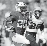  ?? [AP PHOTO] ?? Stanford tailback Bryce Love runs for a touchdown past Arizona State’s Demonte King in the Cardinal’s victory last week.