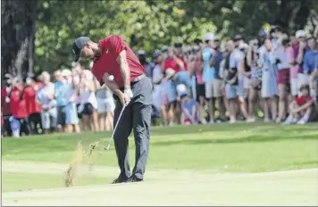  ?? John Amis / Associated Press ?? A rabid gallery looks on as tiger Woods hits from the fifth fairway during the final round of the tour Championsh­ip on Sunday in Atlanta. He finished with a 1-over 71 for his 80th PGA win.