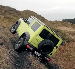  ?? PHOTOS: DAMIEN O’CARROLL/STUFF ?? With a ladder chassis and parttime 4WD with low ratio, the Jimny remains seriously capable off the road.