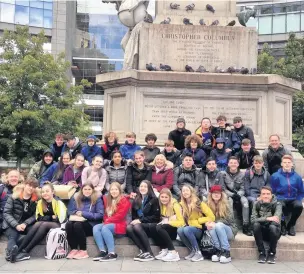  ?? Students from Skelmersda­le’s Our Lady Queen of Peace Catholic Engineerin­g College visiting Columbus Circle, New York ??