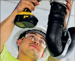  ?? DISPATCH ?? LOGAN RIELY Salvador Gomez works on plumbing in the Le Meridien Columbus, the Joseph hotel in the Short North.